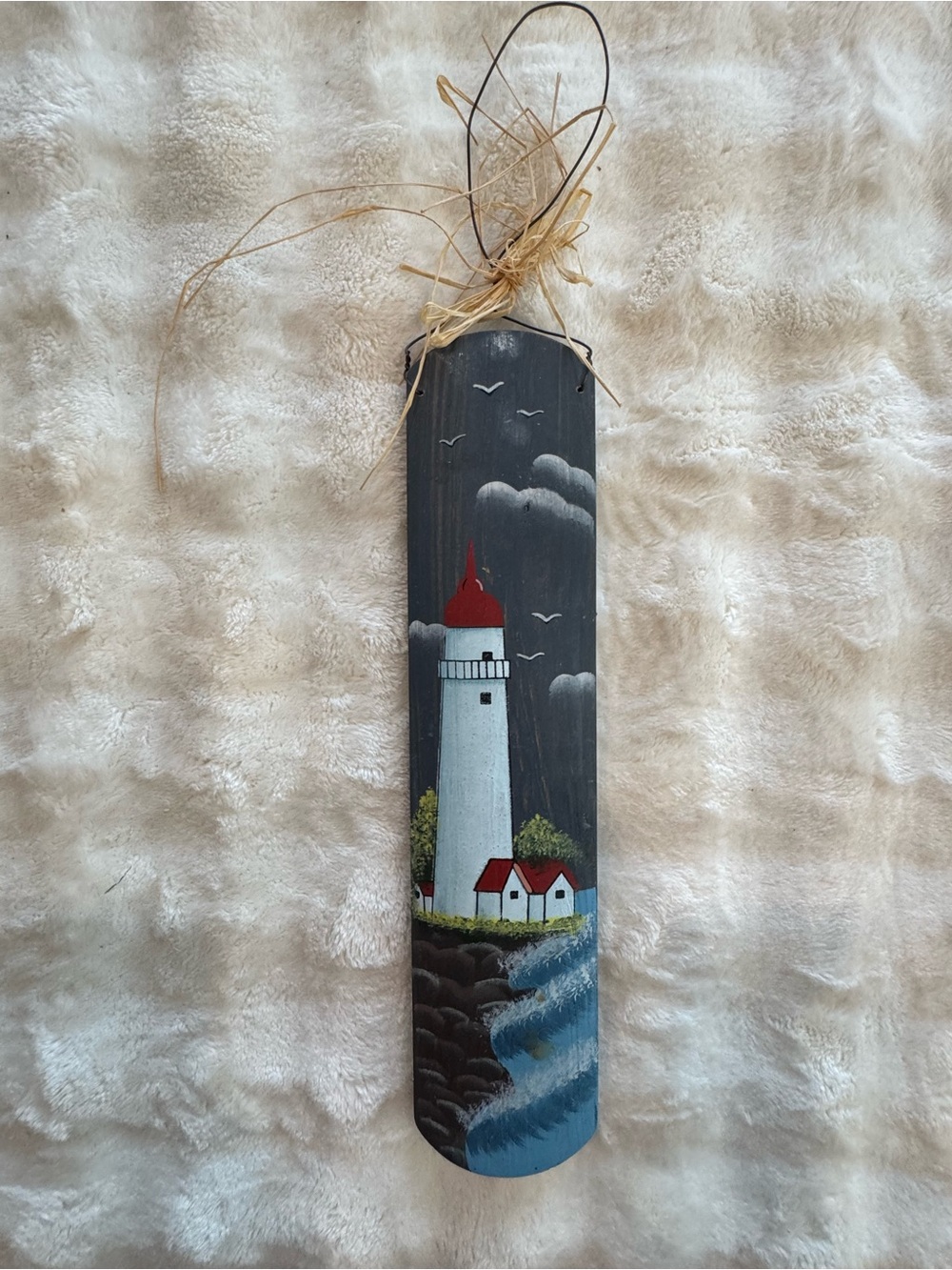 Hand painted folk art lighthouse scene on wood